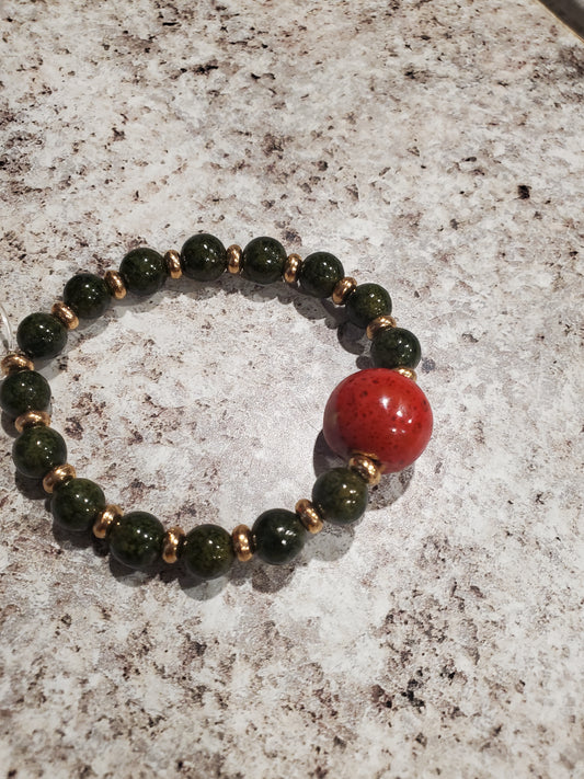 Dark green and orange glass bead bracelet