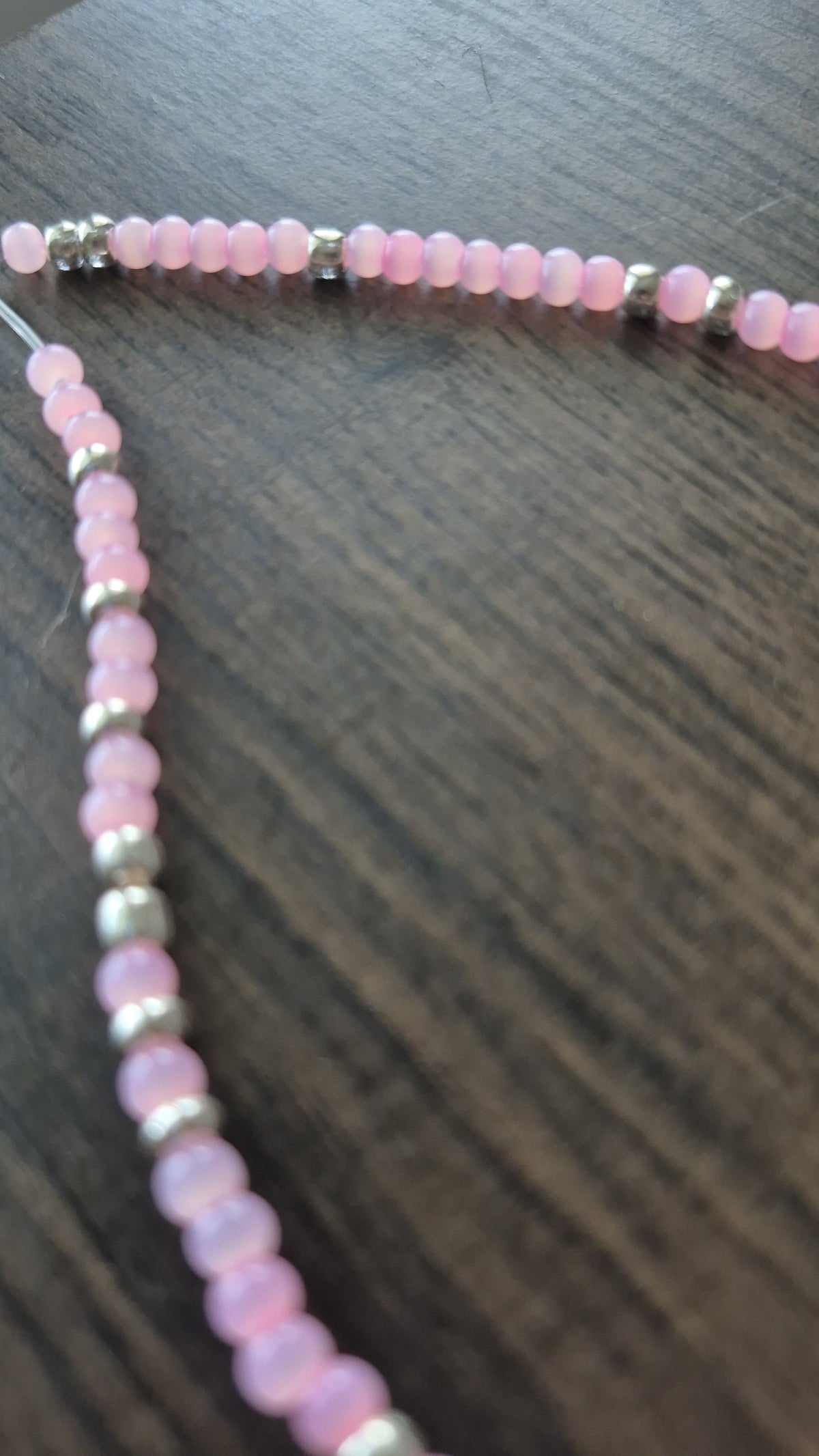 Pink cats eye and silver tie on anklet