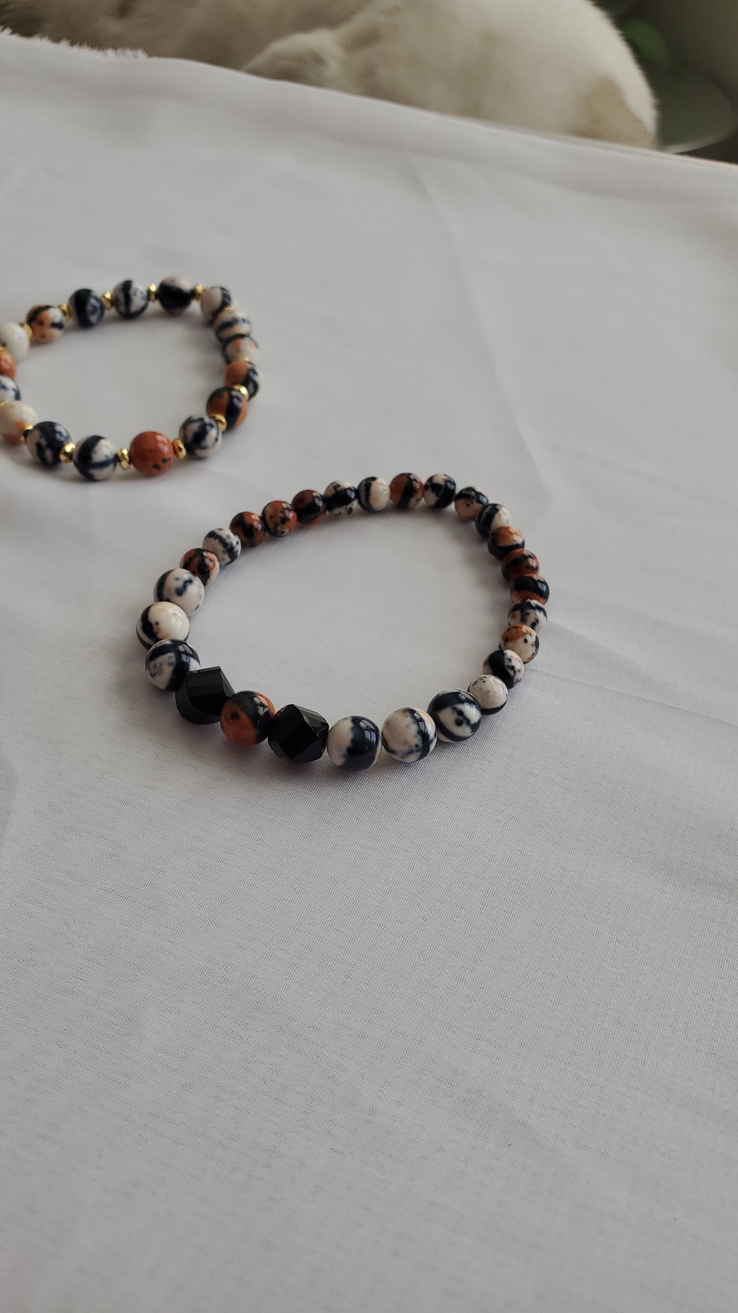 Set of 4 brown and black graphic stacked bracelets