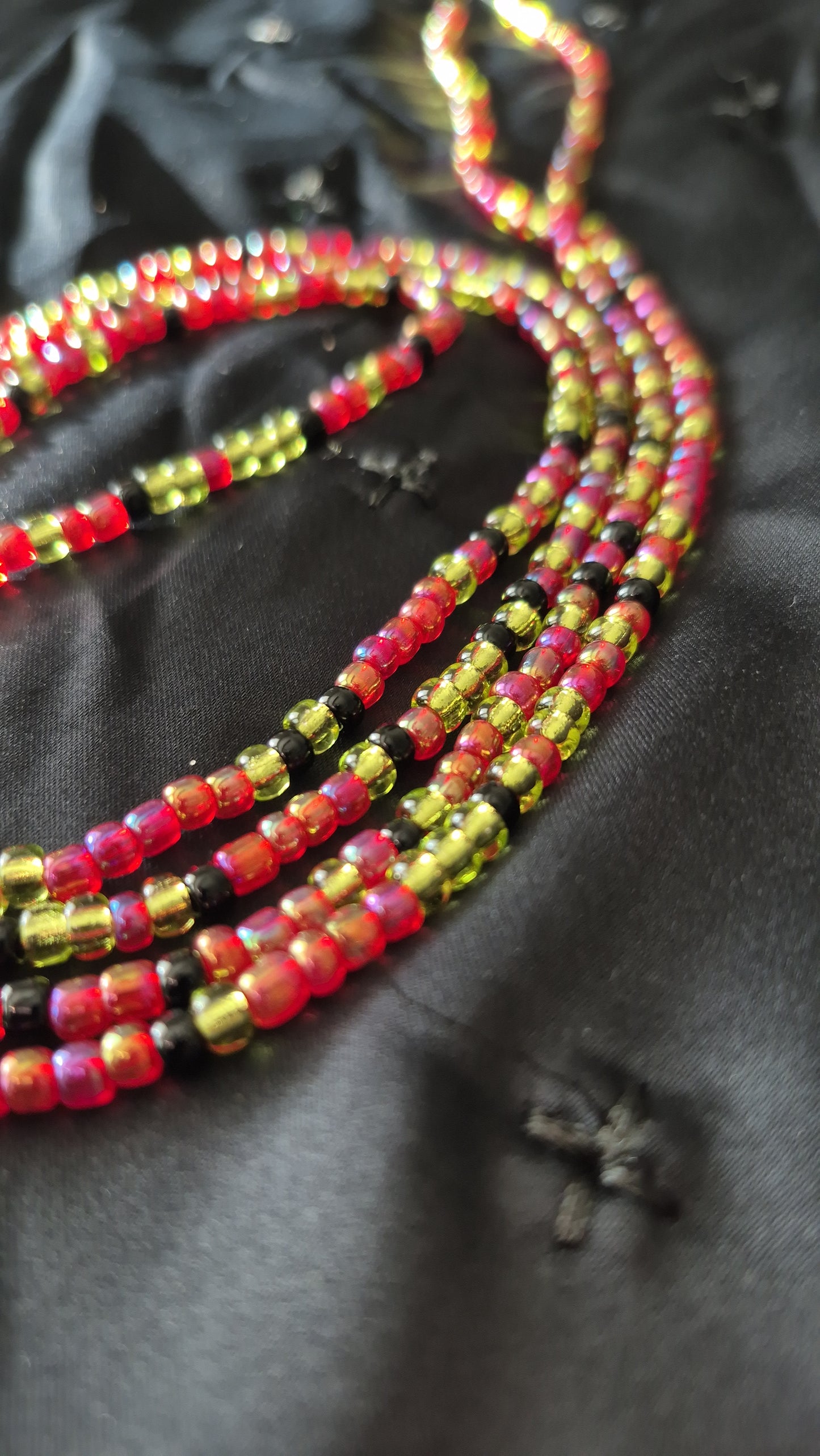 Red, green and black tie on handcrafted waistbead