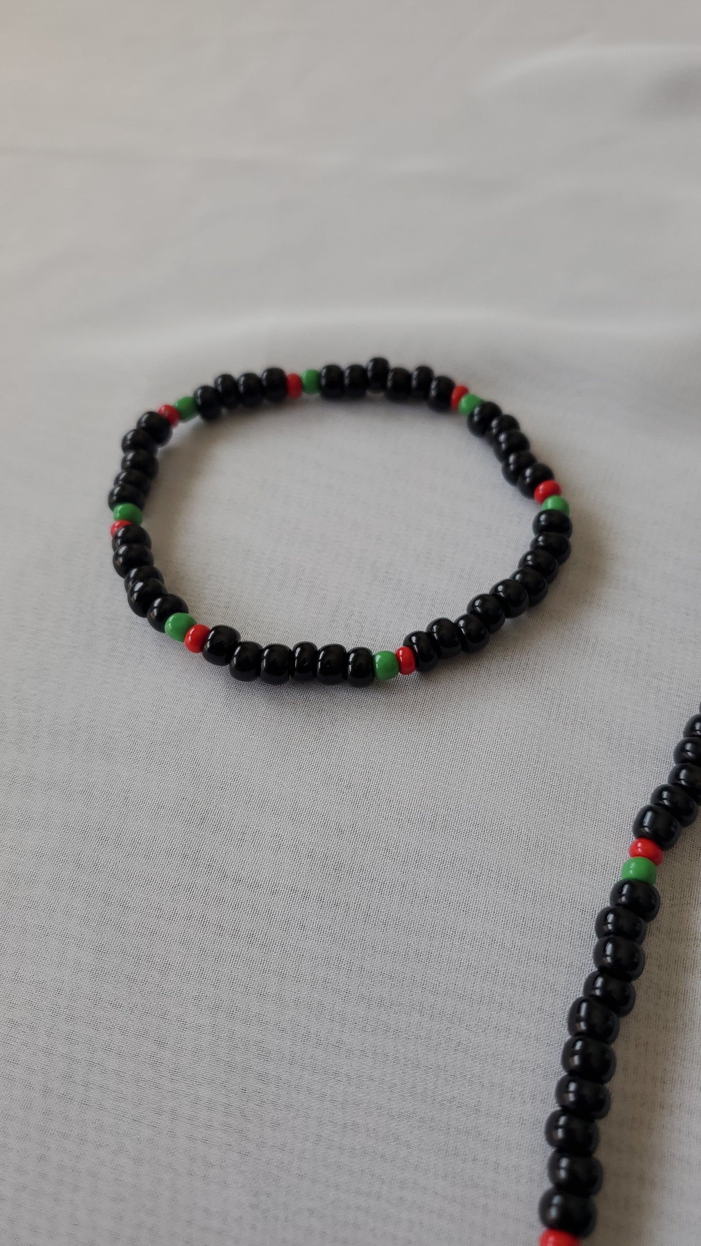 Black, green and red beaded necklace set for men