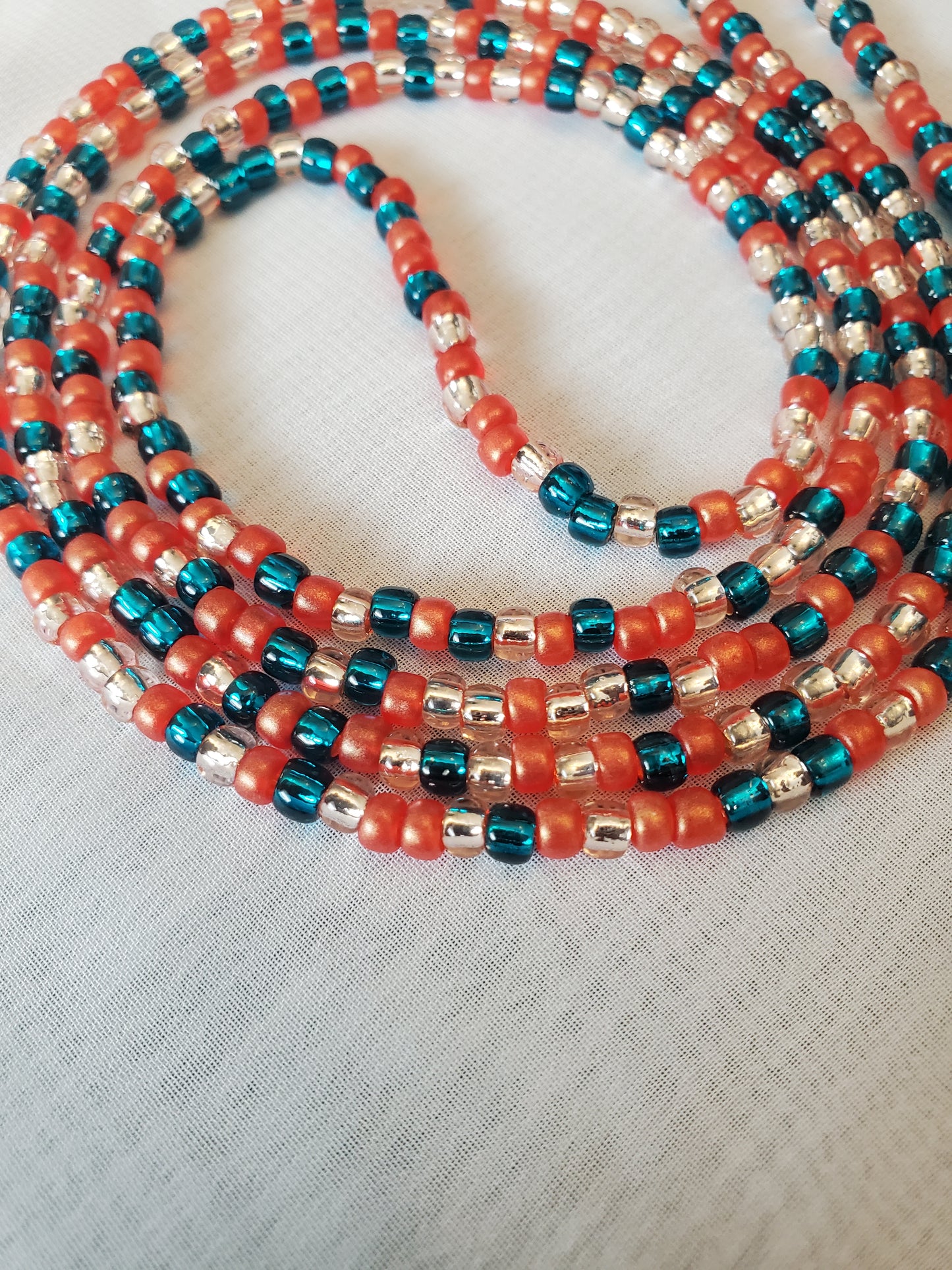 Handcrafted Ruby, teal, light gold waistbead