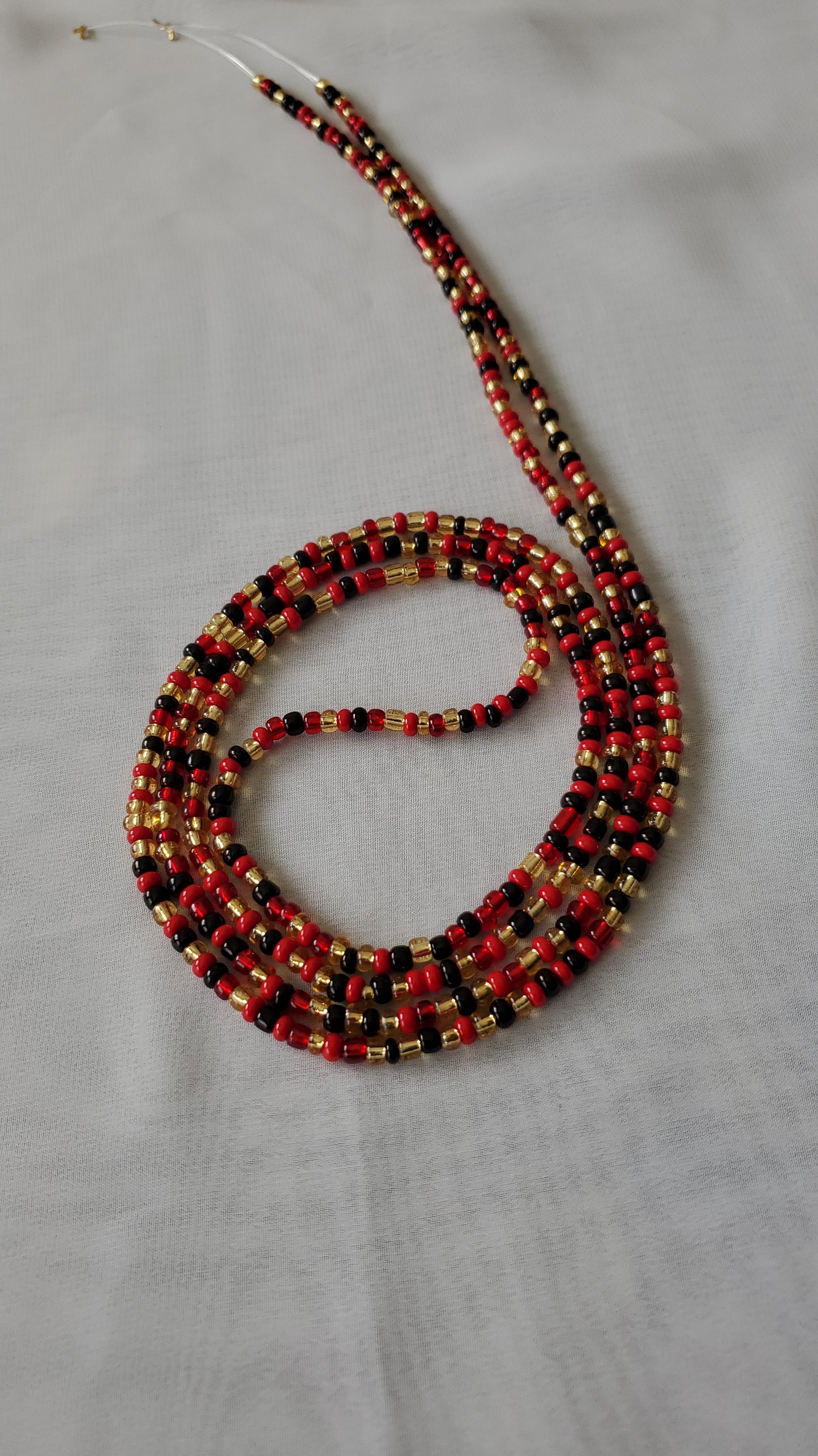 Red, black and gold waistbead