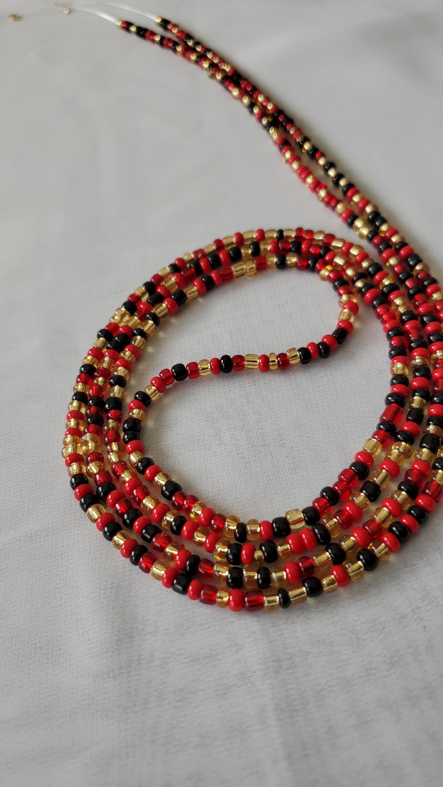 Red, black and gold waistbead