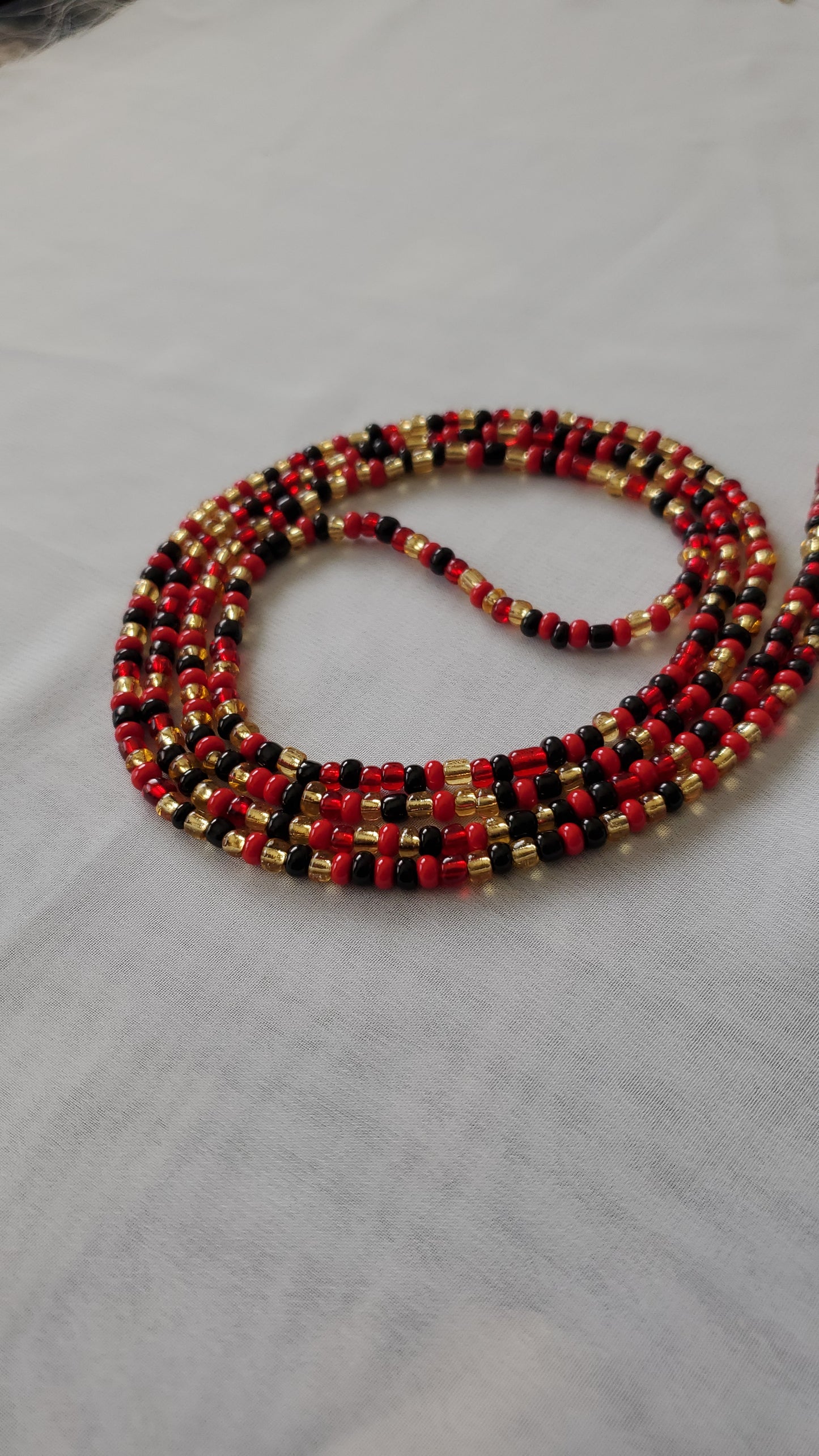 Red, black and gold waistbead