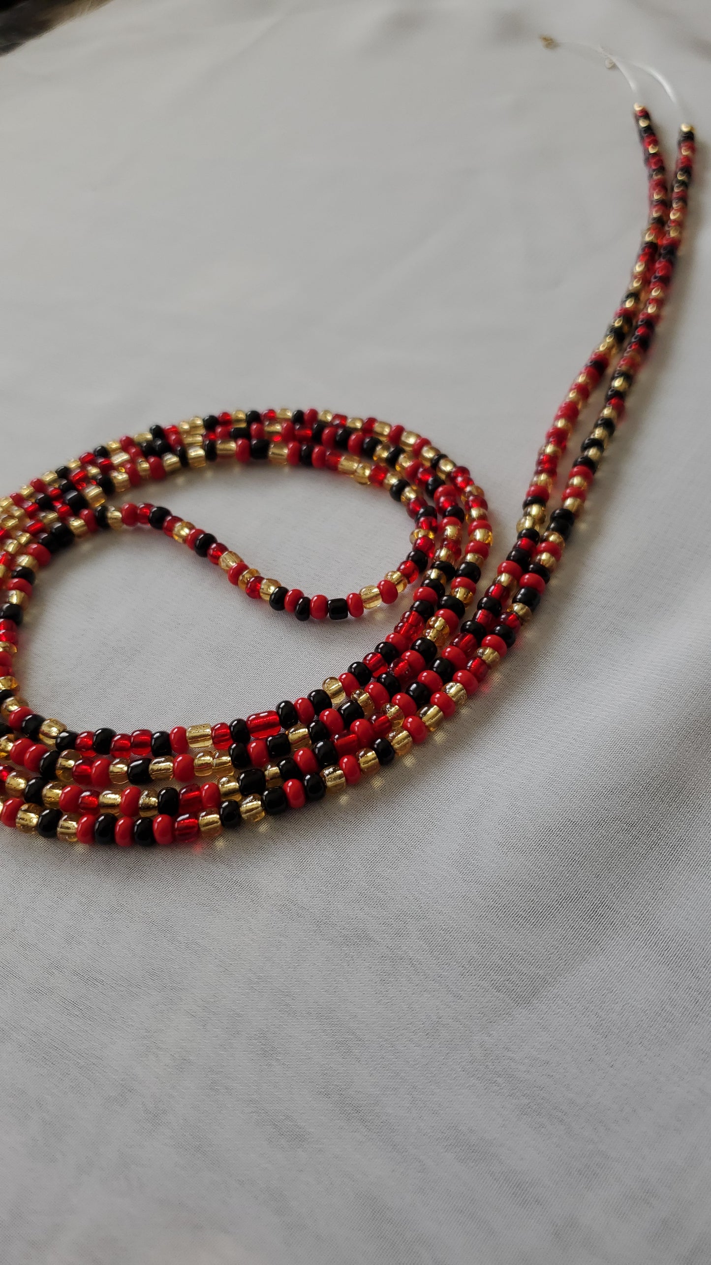 Red, black and gold waistbead