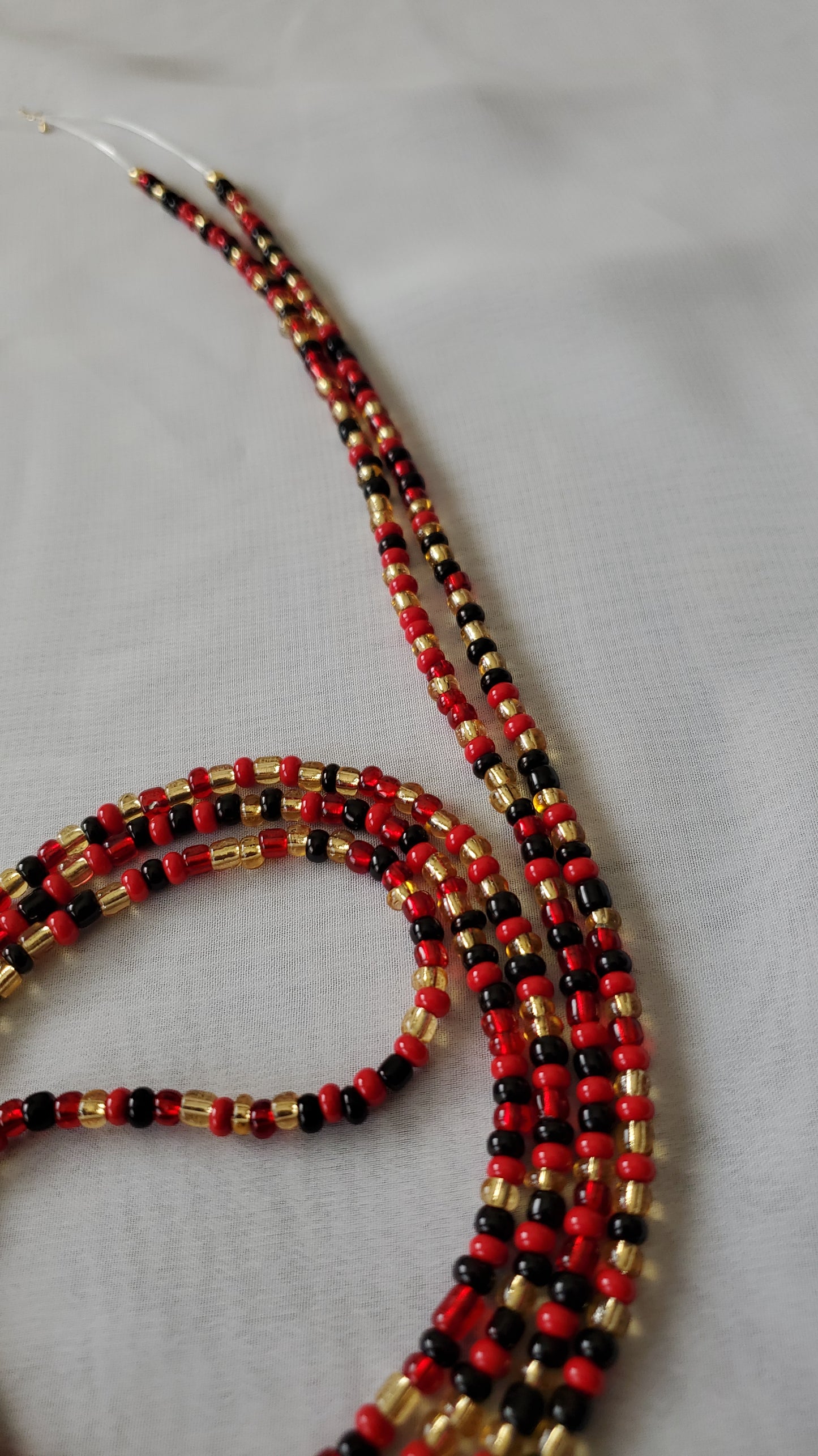 Red, black and gold waistbead