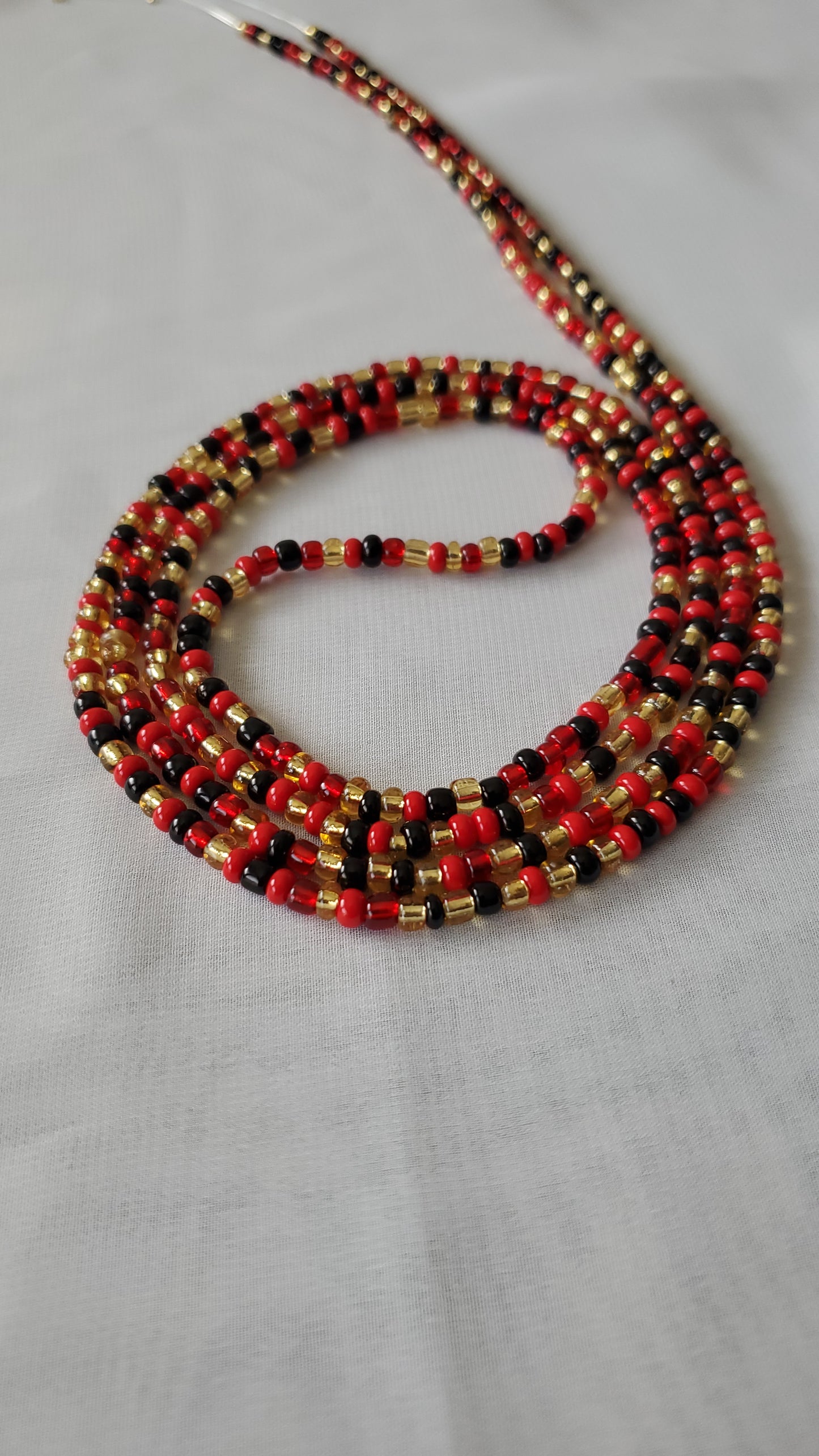 Red, black and gold waistbead