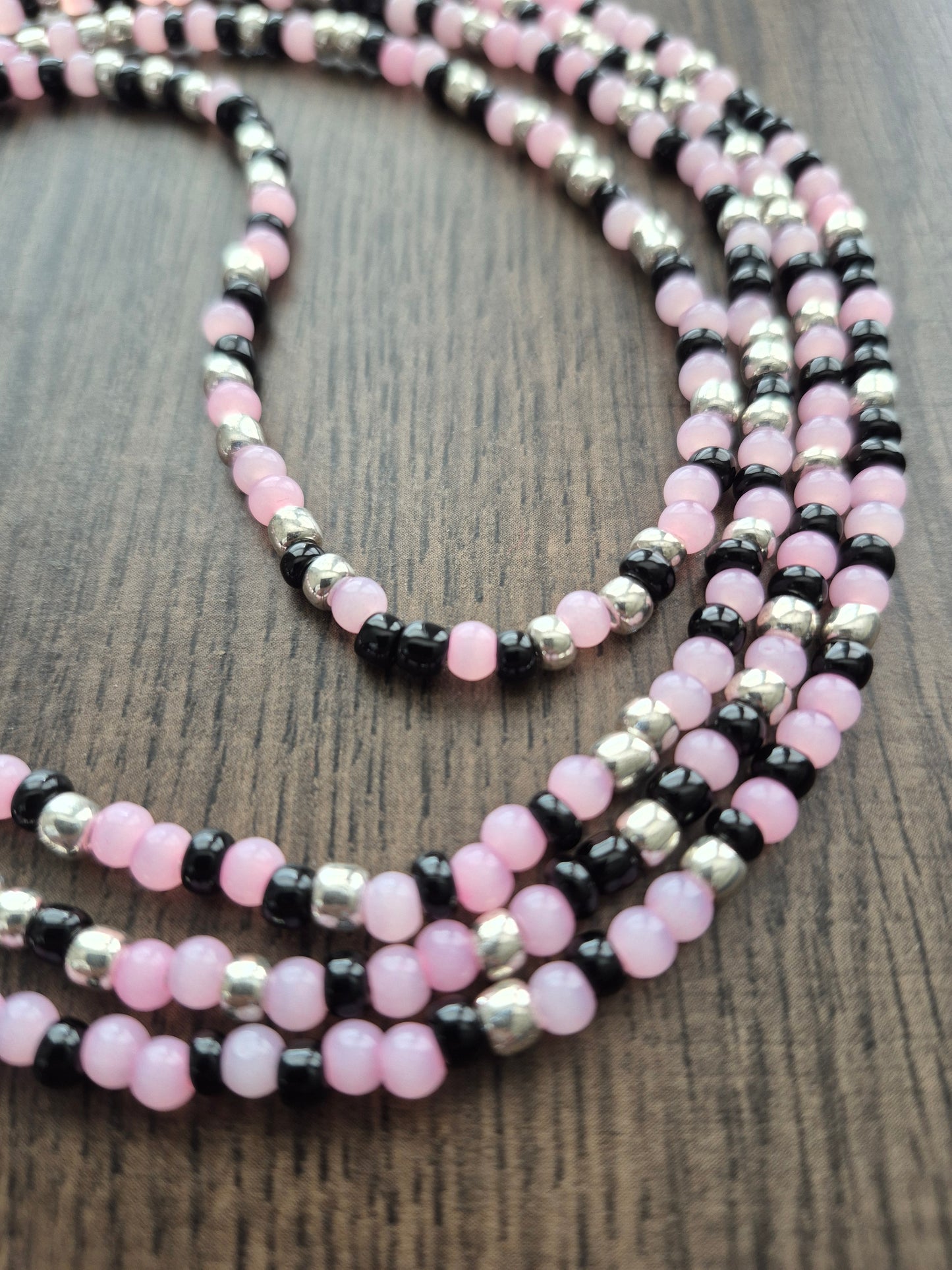 Handcrafted pink, black, and silver blend Tie Waistbead