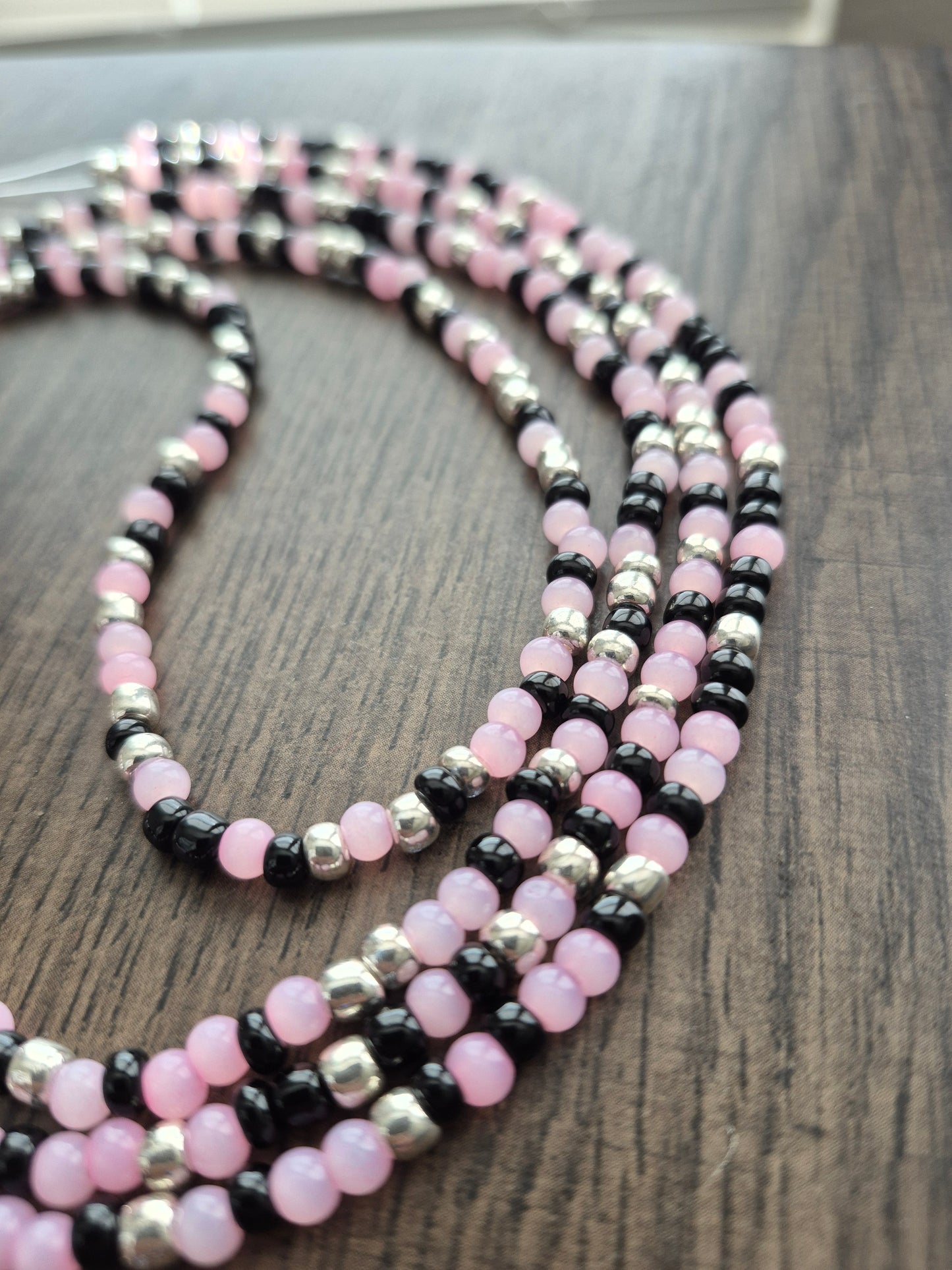 Handcrafted pink, black, and silver blend Tie Waistbead