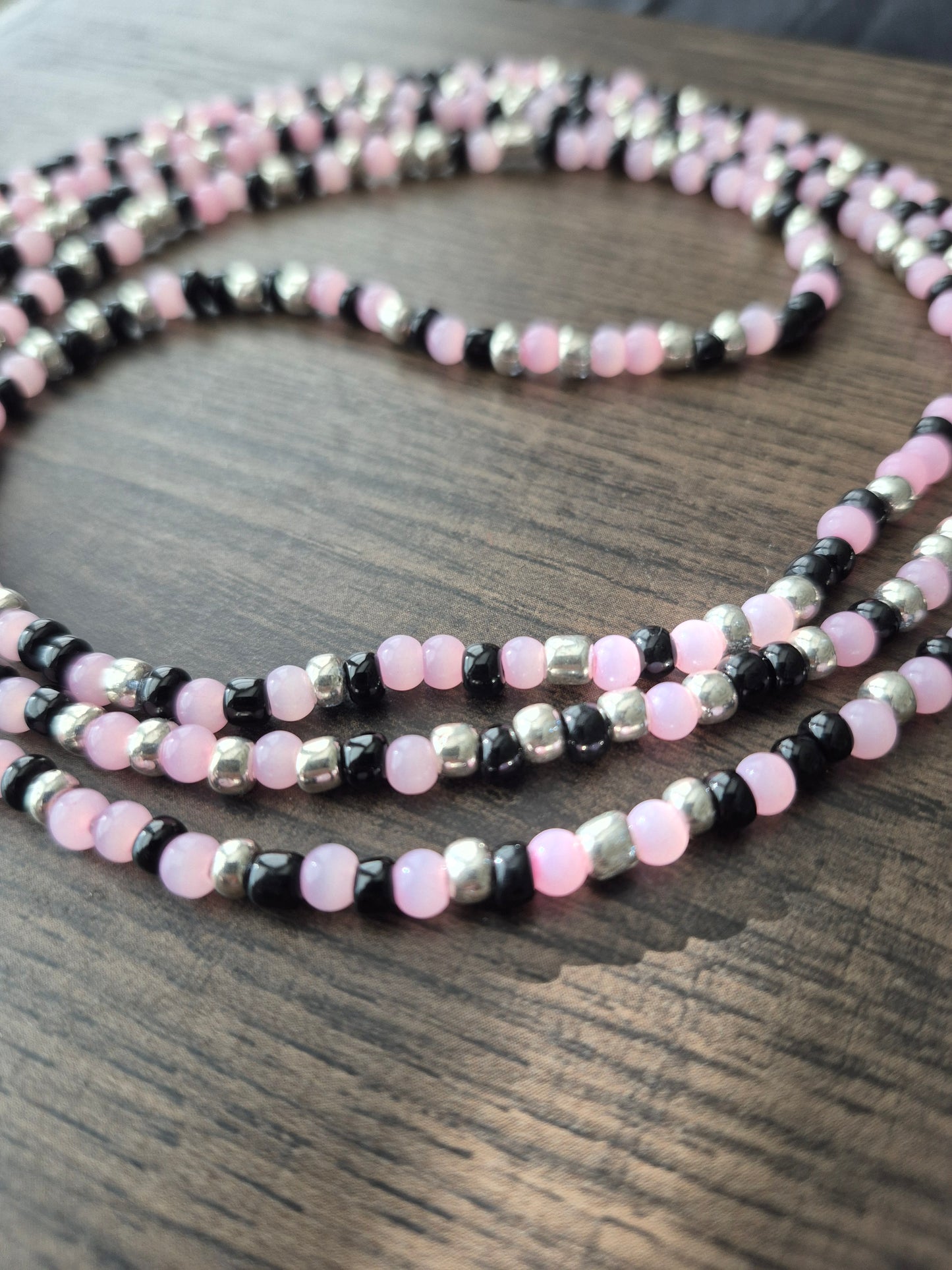 Handcrafted pink, black, and silver blend Tie Waistbead