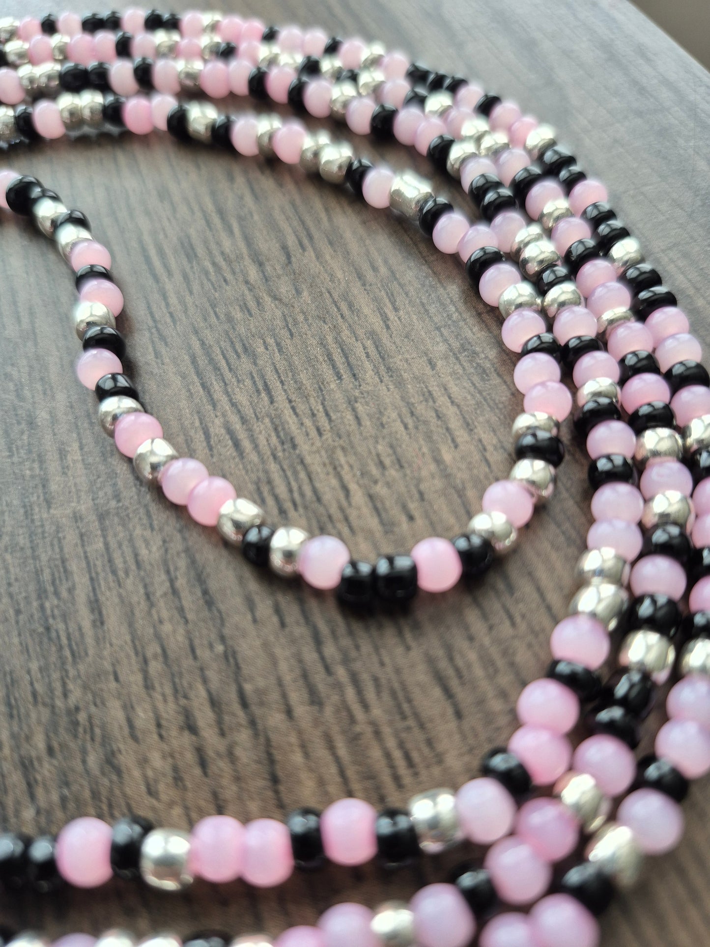 Handcrafted pink, black, and silver blend Tie Waistbead