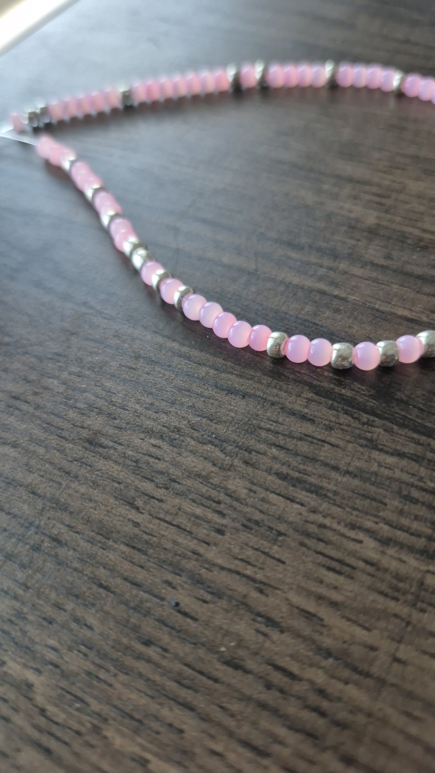 Pink cats eye and silver tie on anklet