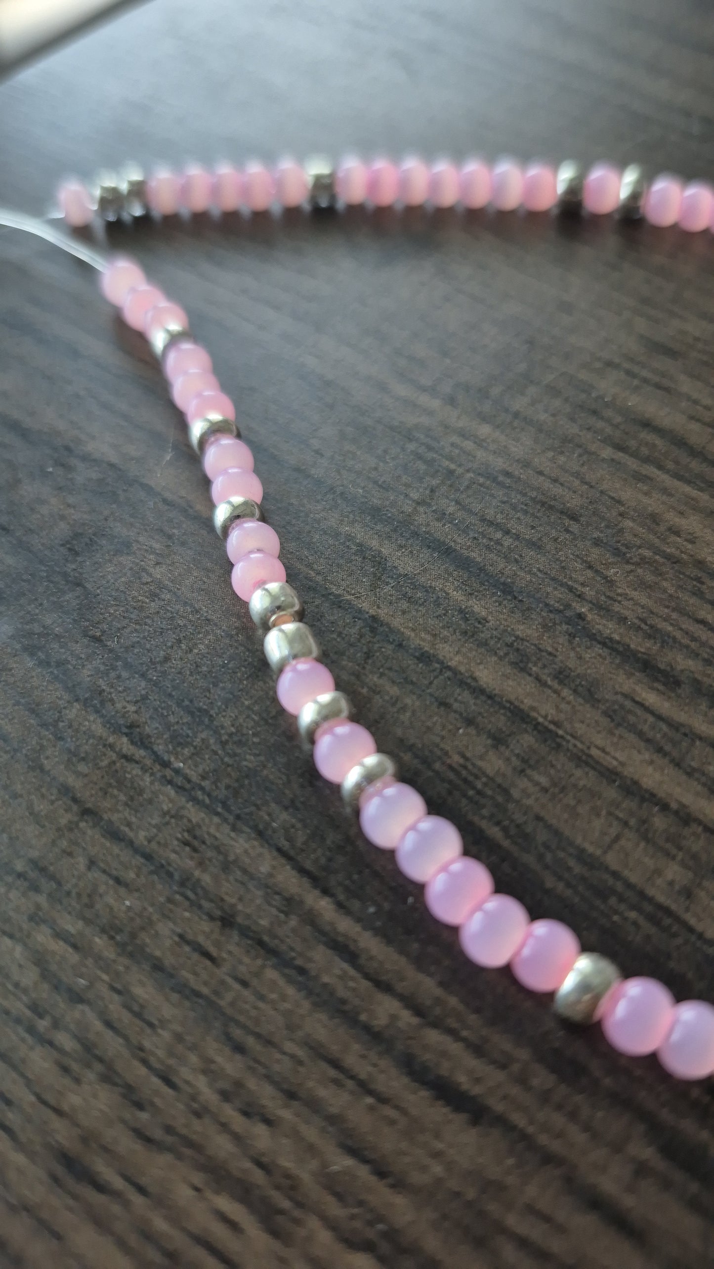 Pink cats eye and silver tie on anklet