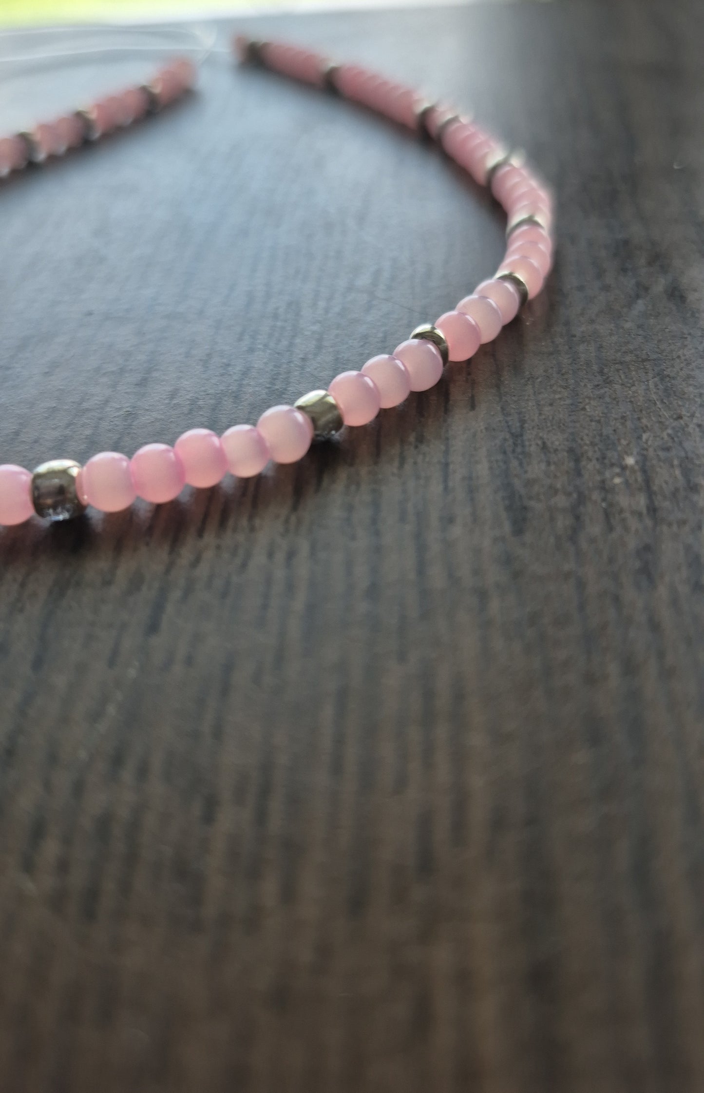 Pink cats eye and silver tie on anklet