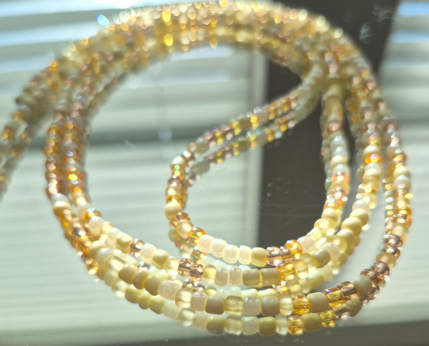 Cream and gold tie on waistbead