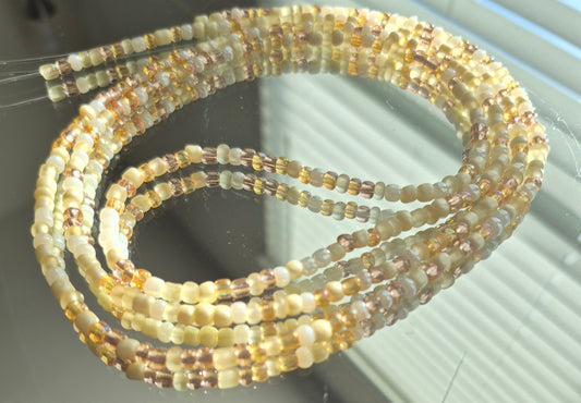 Cream and gold tie on waistbead