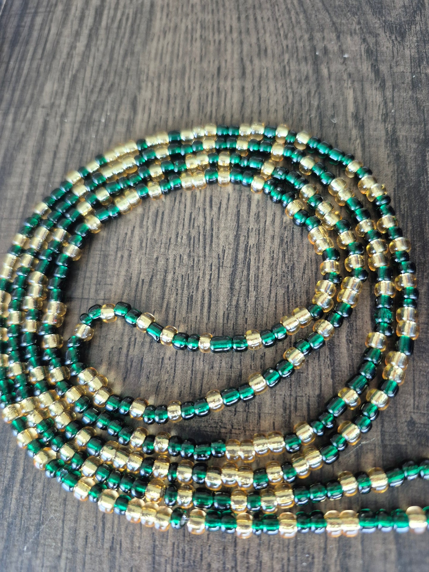 Emerald green and gold tie on waistbead