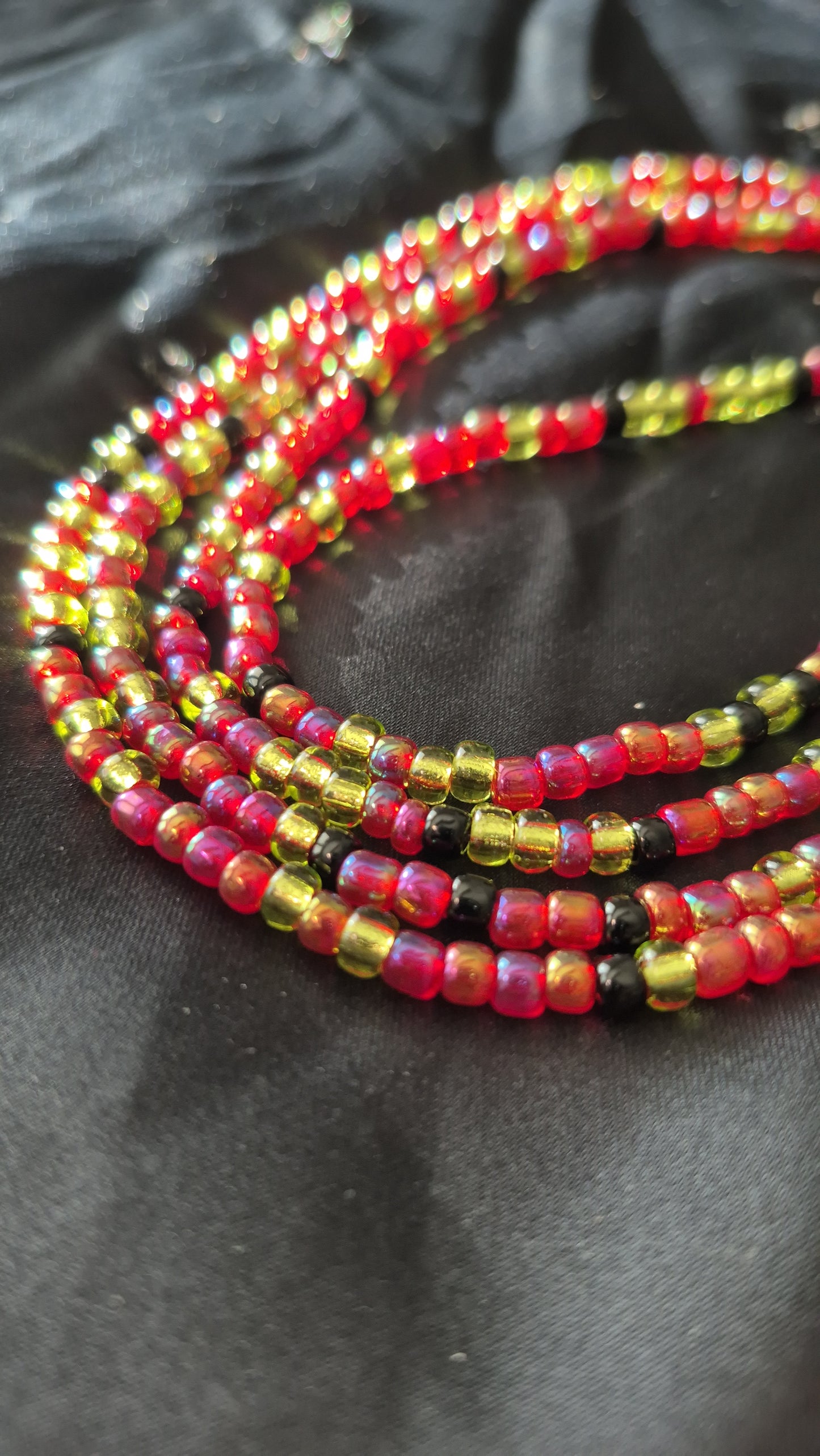 Red, green and black tie on handcrafted waistbead