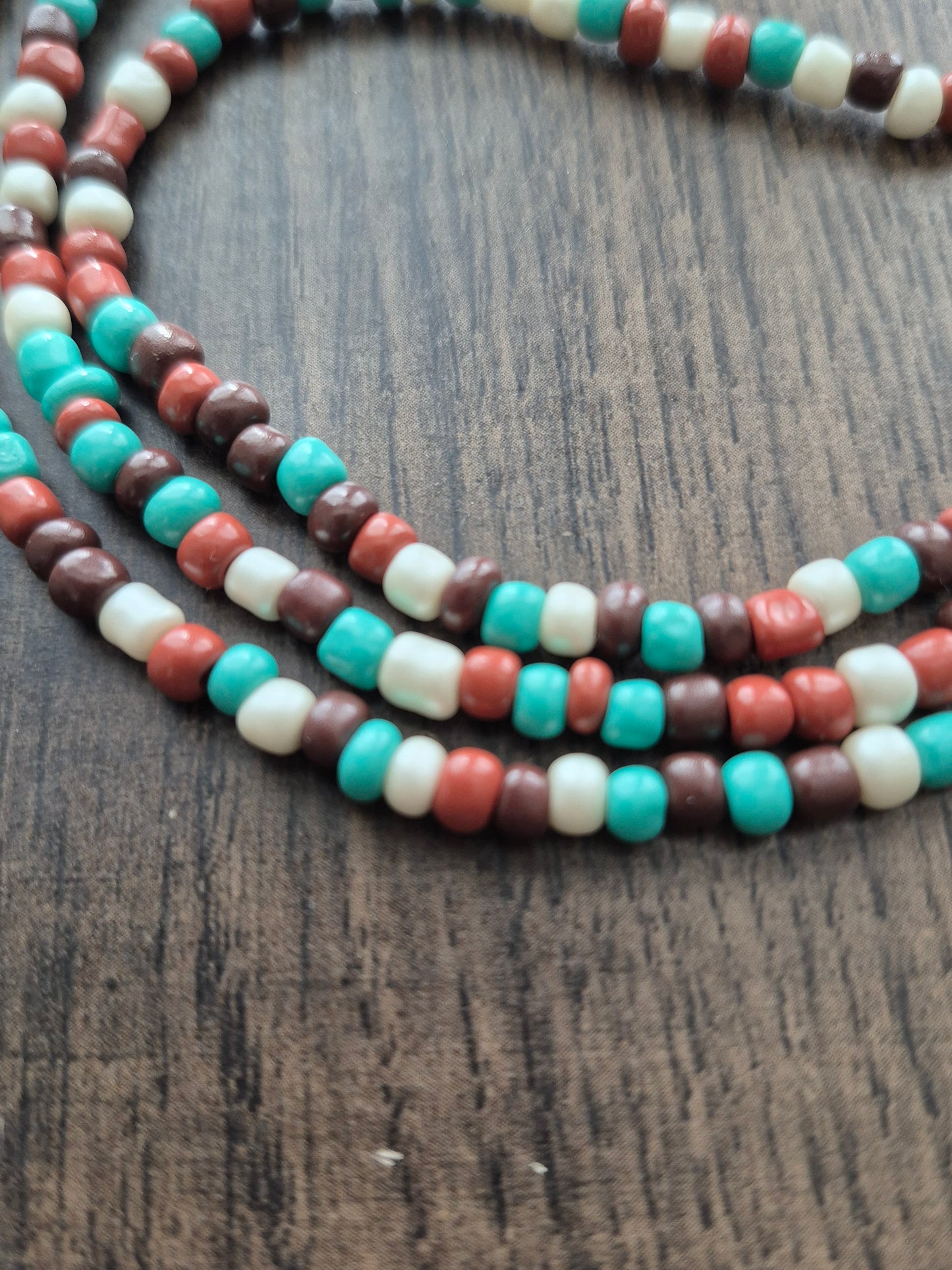 Brown, cream and teal tie on waistbead