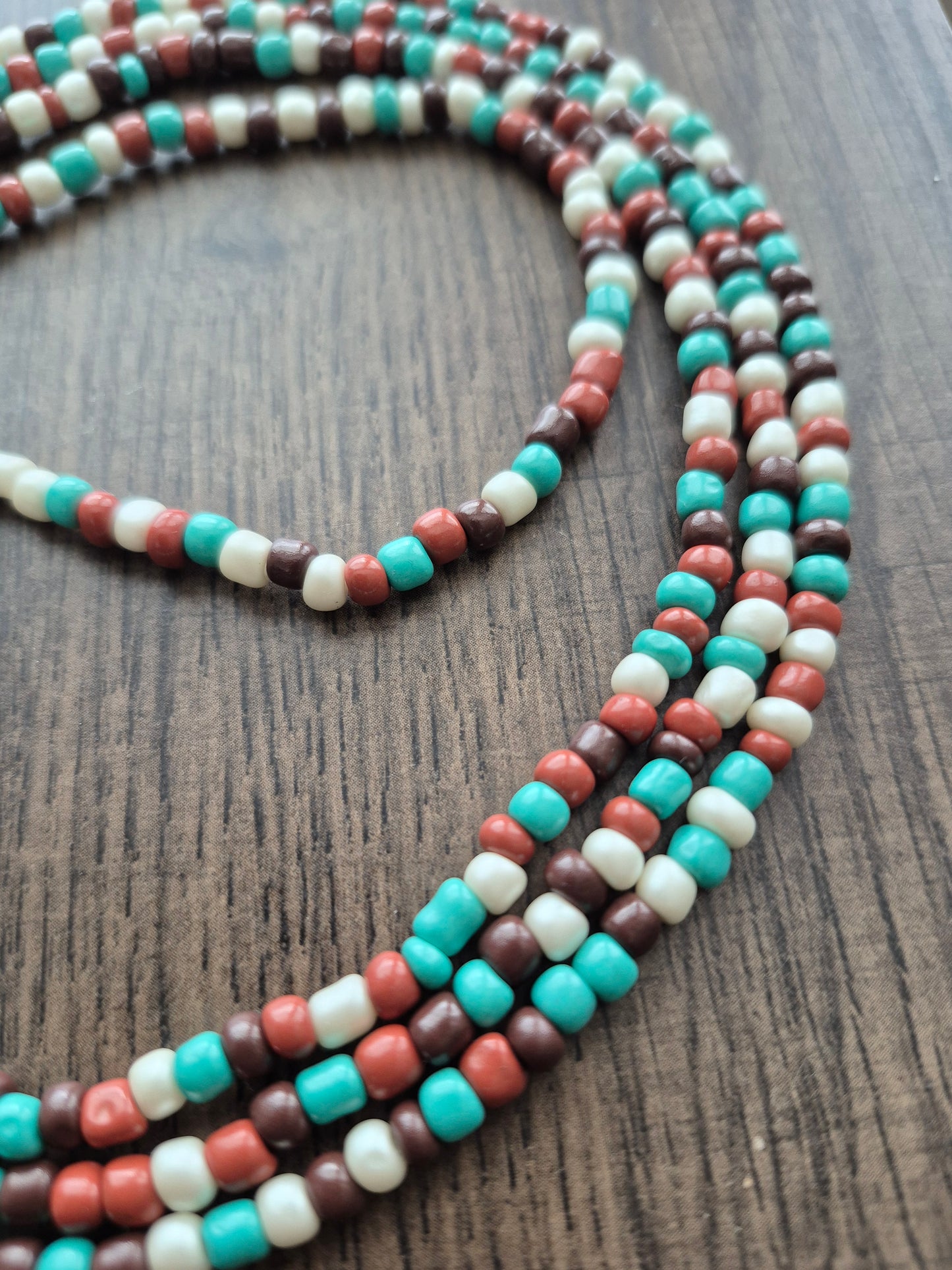 Brown, cream and teal tie on waistbead