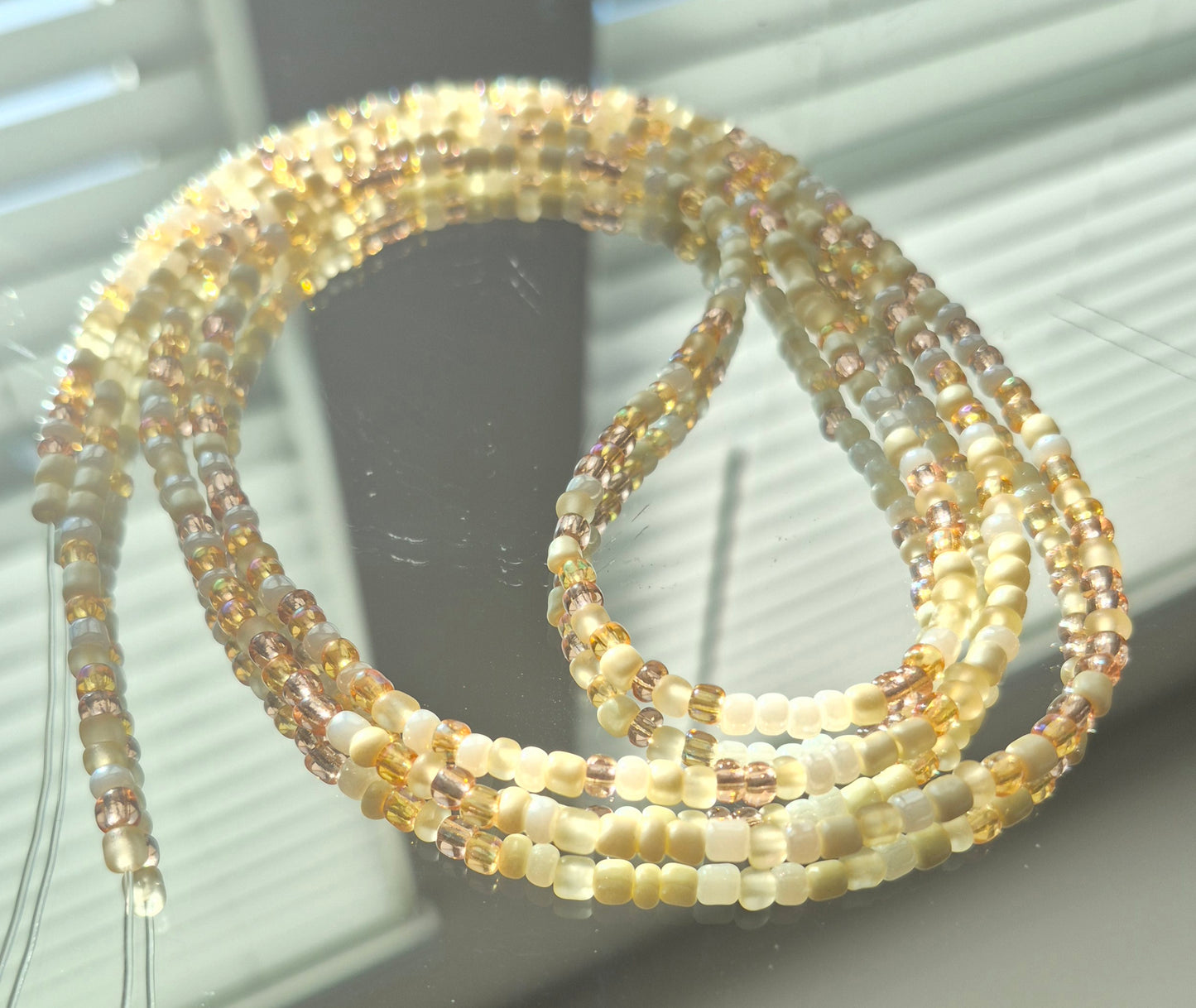 Cream and gold tie on waistbead