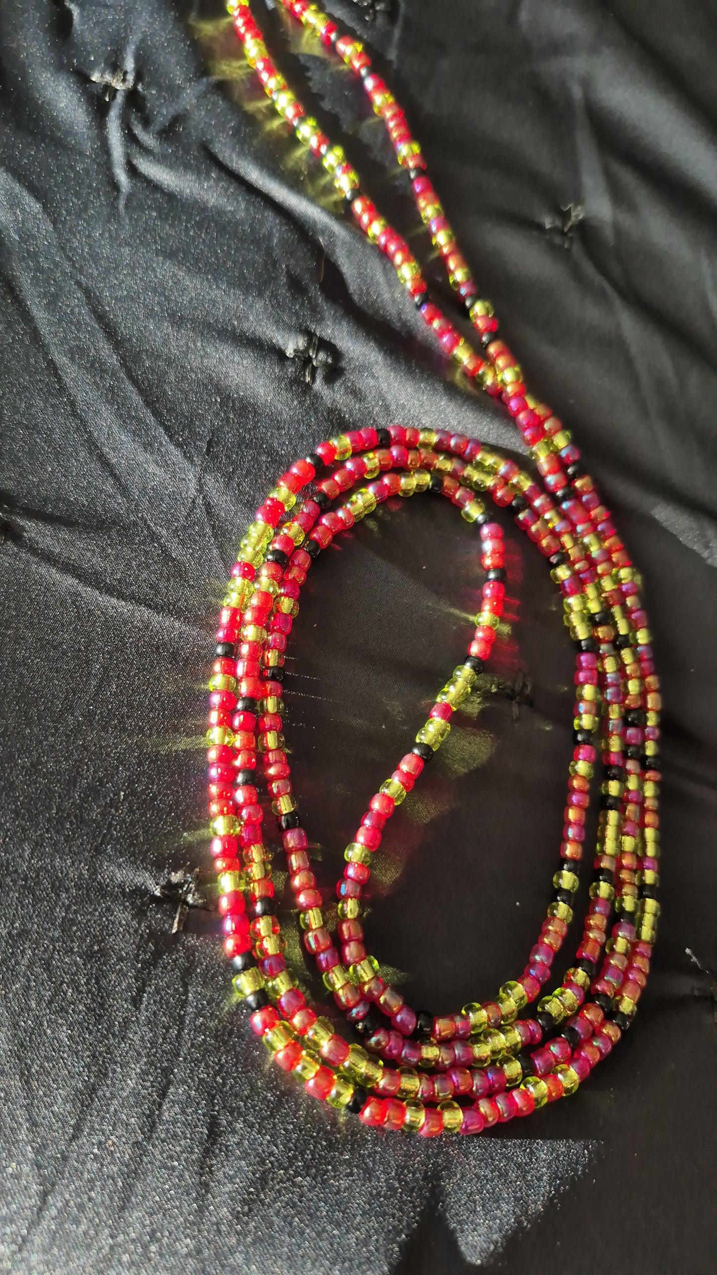 Red, green and black tie on handcrafted waistbead
