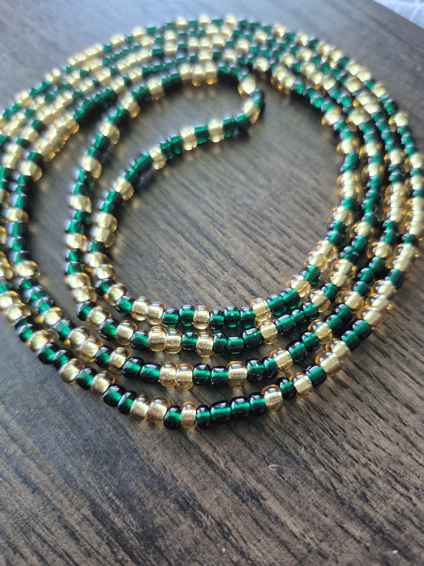 Emerald green and gold tie on waistbead